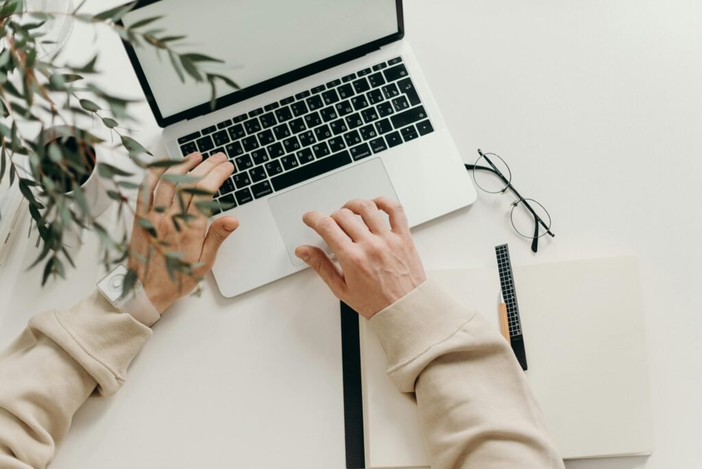 Where Do Deleted Files Go? 2 Free An overhead view of a person working on a laptop in a minimalist home office setting. Stock Photo