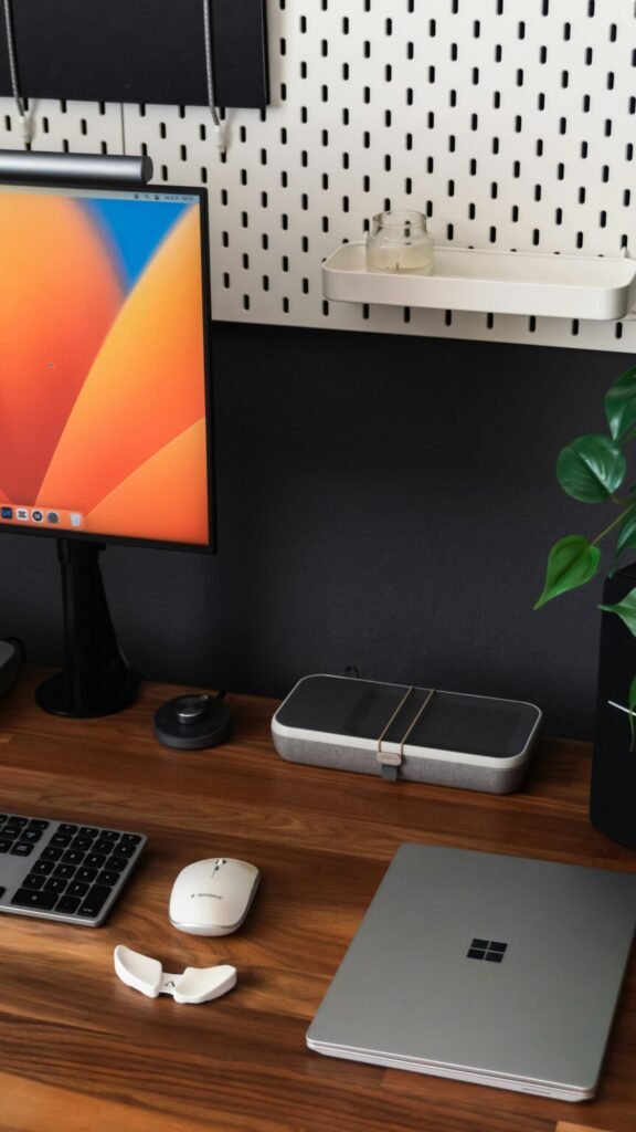 Project Chaos to Clarity: How Microsoft Planner Transforms Small Businesses 8 a desk with a laptop, keyboard, mouse and a monitor